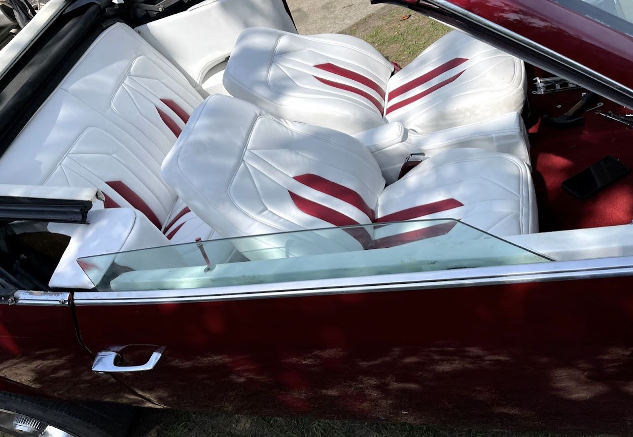 White and burgundy custom seats in a convertible