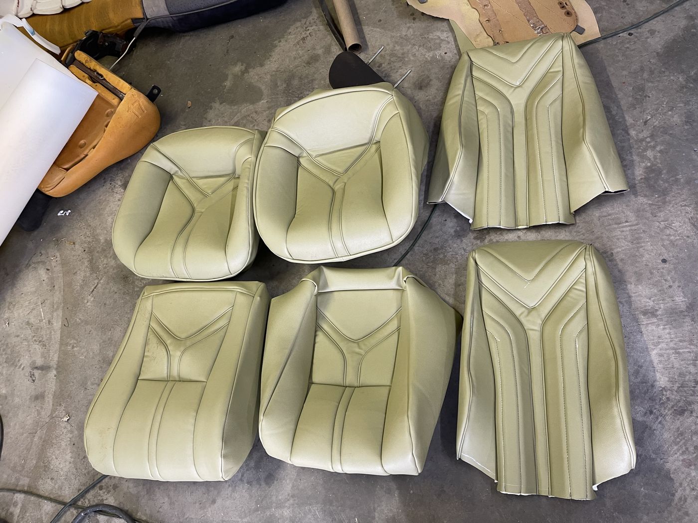 Light green leather seat panels ready for install