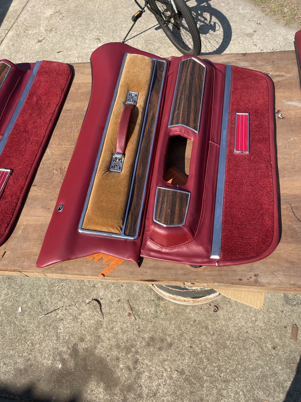 Burgundy door panels with woodgrain trim