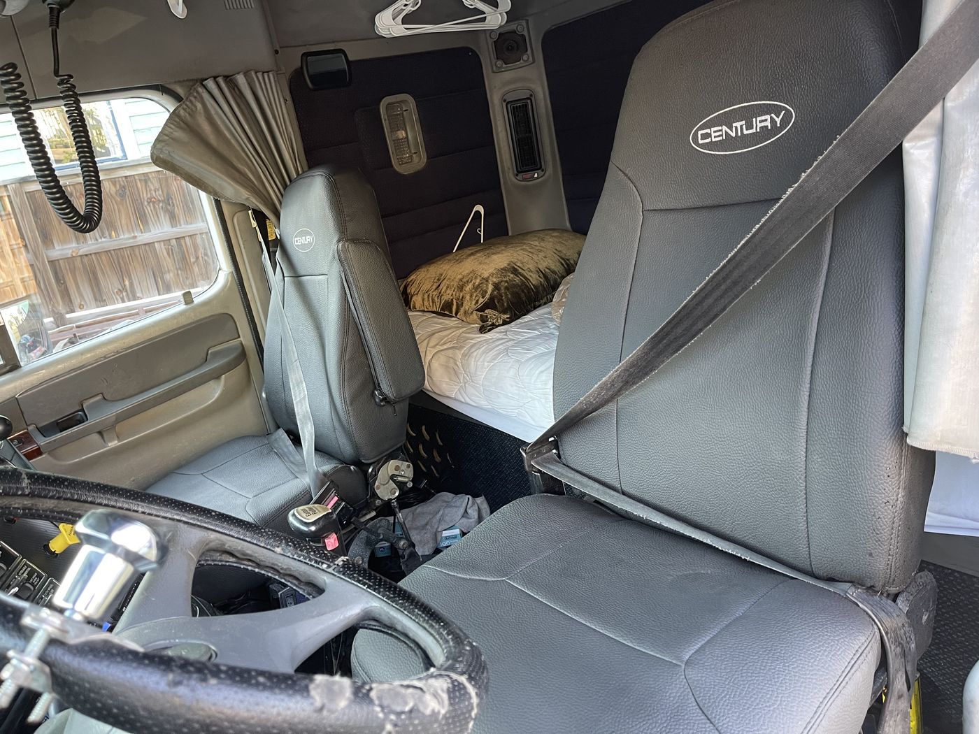 Black leather truck seats with embroidered headrests