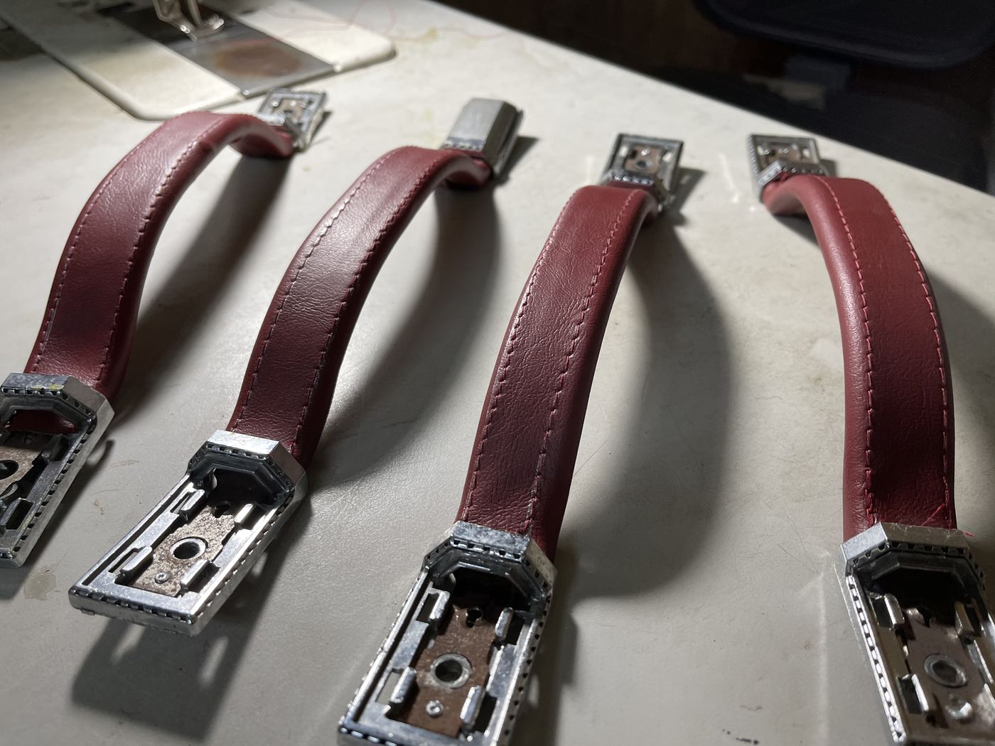 Burgundy leather grab handles