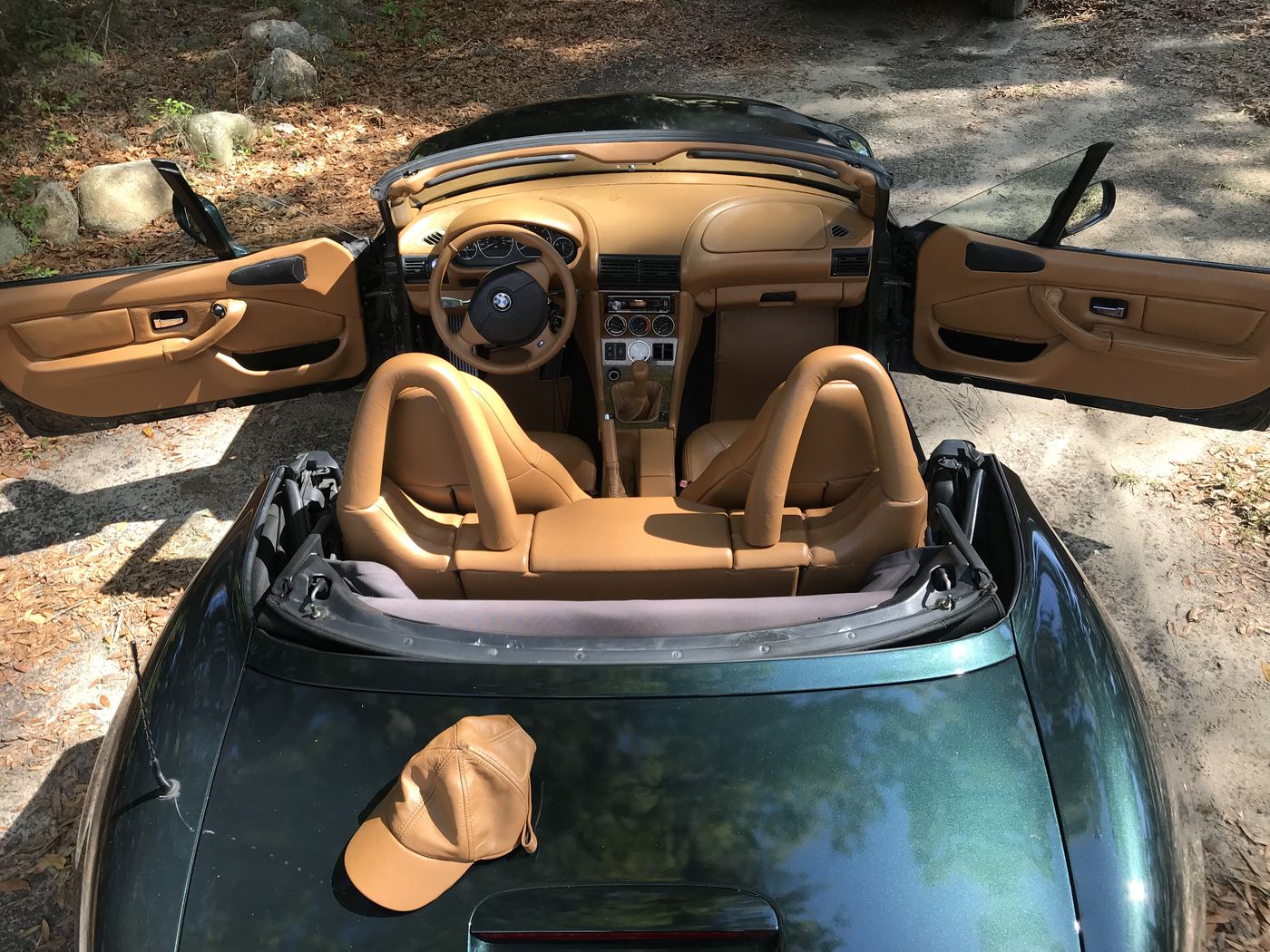 Saddle leather interior in a green convertible