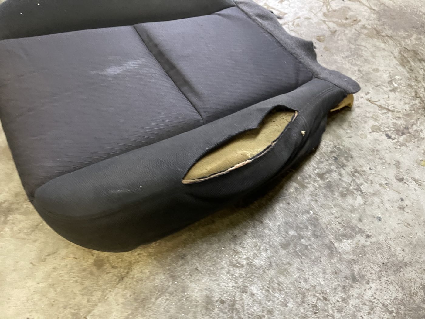 Worn seat cushion before repair