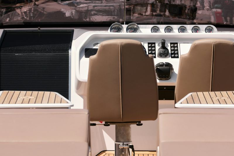 Tan vinyl helm seats on a boat